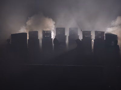 Sunn O))) Performing at The Troxy in July 2026. Shot from back of the venue showing the wall of amplifiers amongst dark smoke. Shot by Jonathan Dadds